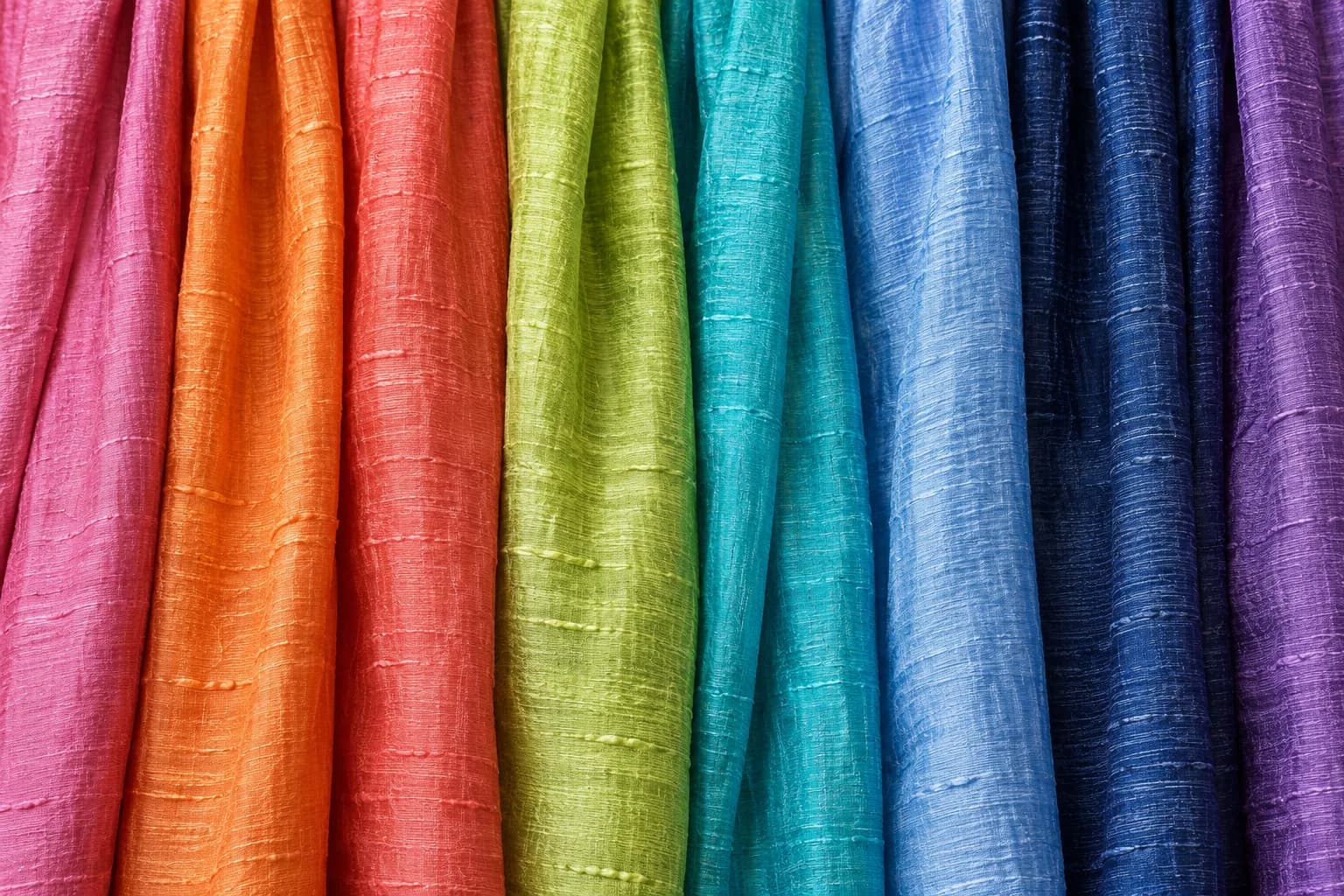 Handwoven silk scarves in a spectrum of natural colours